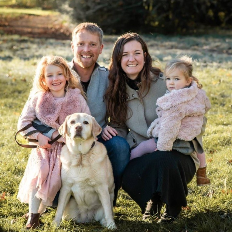 Nick Doney and his wife, two daughters and dog